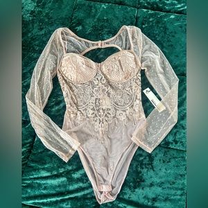 This is a beautiful one of a kind Lacey bodysuit